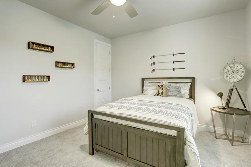 Staged bedroom with golf club decor.