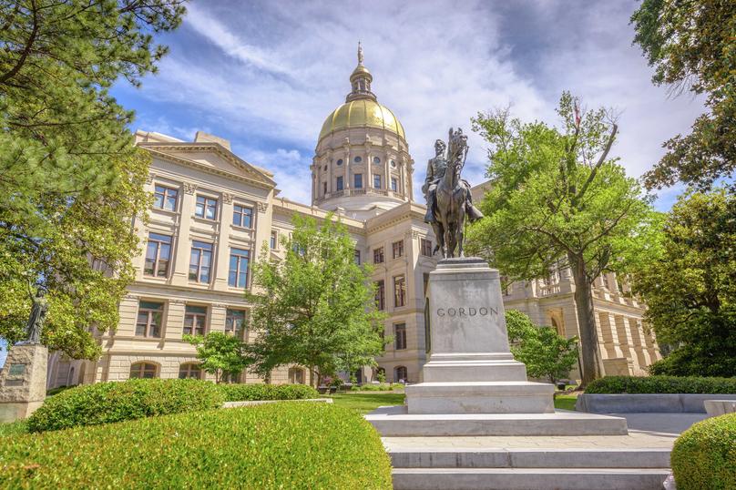 Atlanta, Georgia State Capitol building with gold-topped dome, statue of John B. Gordon in the front, and beautifully landscaped grounds
