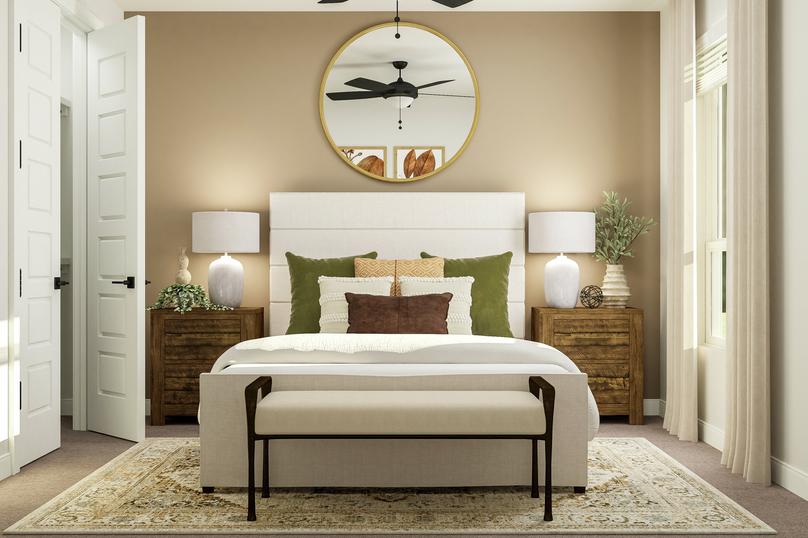Rendering of a secondary bedroom
  featuring a large white-framed bed, two nightstands, and large mirror along a
  sand accent wall. The step-in closet is to the left.