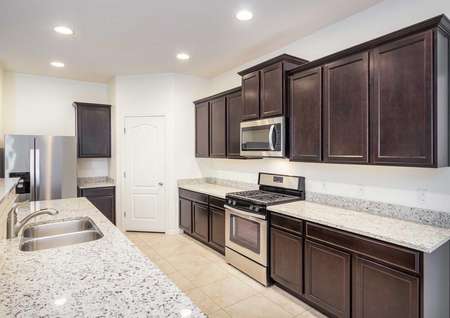 Cimarron kitchen with granite countertops and espresso cabinets.