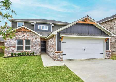 The Murray plan has incredible curb appeal with brick and siding detailing.