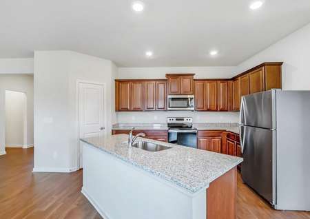 Chef-ready kitchen with spacious countertops and a full suite of appliances. 