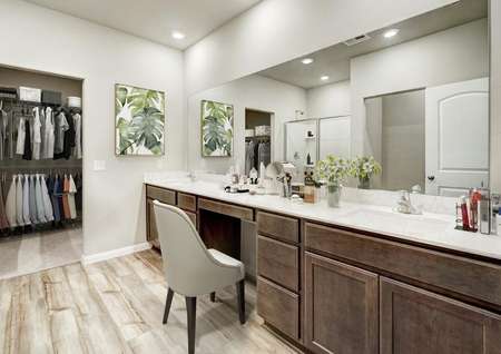 Staged master bath with a make-up vanity.