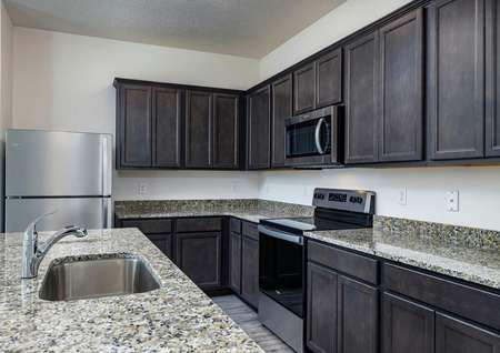 Chef-ready kitchen with beautiful granite countertops, all new stainless steel appliances and spacious cabinets.