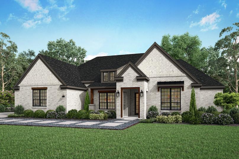 The Bradley is a beautiful, three-bedroom home with a light brick exterior.
