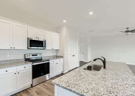 Love cooking in this kitchen with features like a large sink and expansive counter space.