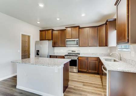Roosevelt kitchen with modern cabinets, undermount sink, and light color granite countertops