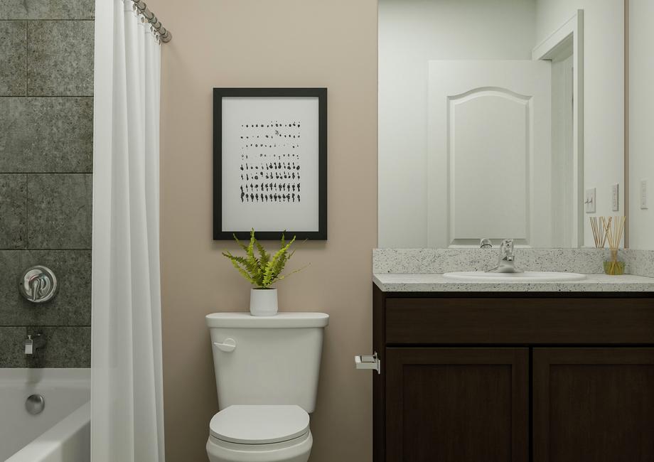 Rendering of a
  secondary bathroom showcasing a dark wood vanity, toilet, and tub with a
  white shower curtain. Natural dÃ©cor is throughout.