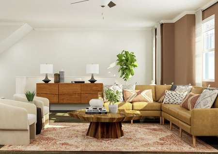 Rendering of the living room furnished
  with a sectional, two armchairs and a coffee table. The space has several
  windows, vinyl plank wood flooring and the staircase is visible in the
  background.