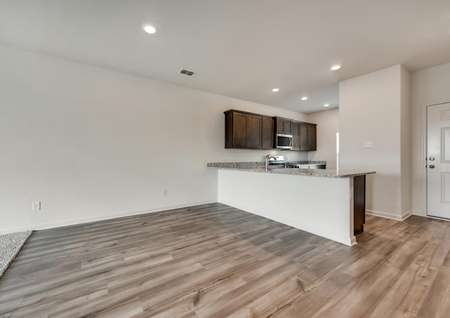 The kitchen is open to the dining room in this spacious, open layout.