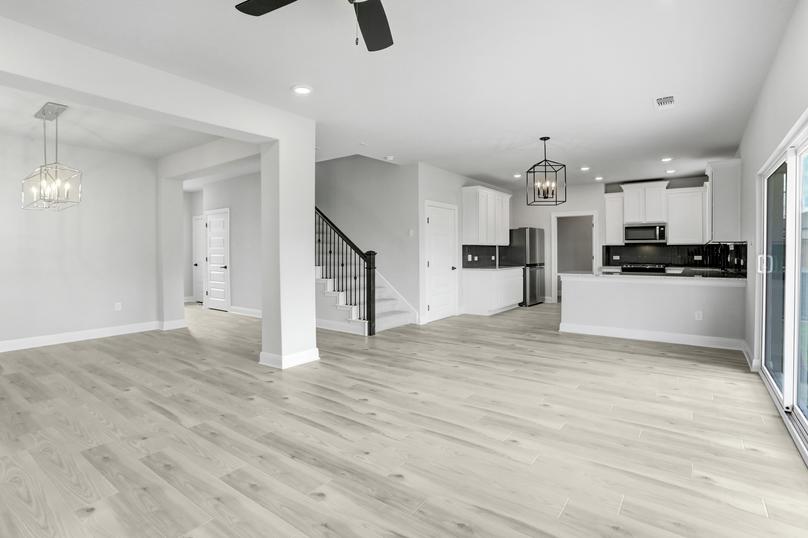 Open-concept layout with the dining room opening up to the living room, and the kitchen overlooks the family room.
