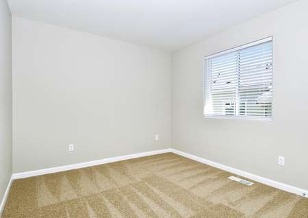 Secondary bedroom with carpet